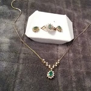 Diamond and emerald necklace earrings and a ring